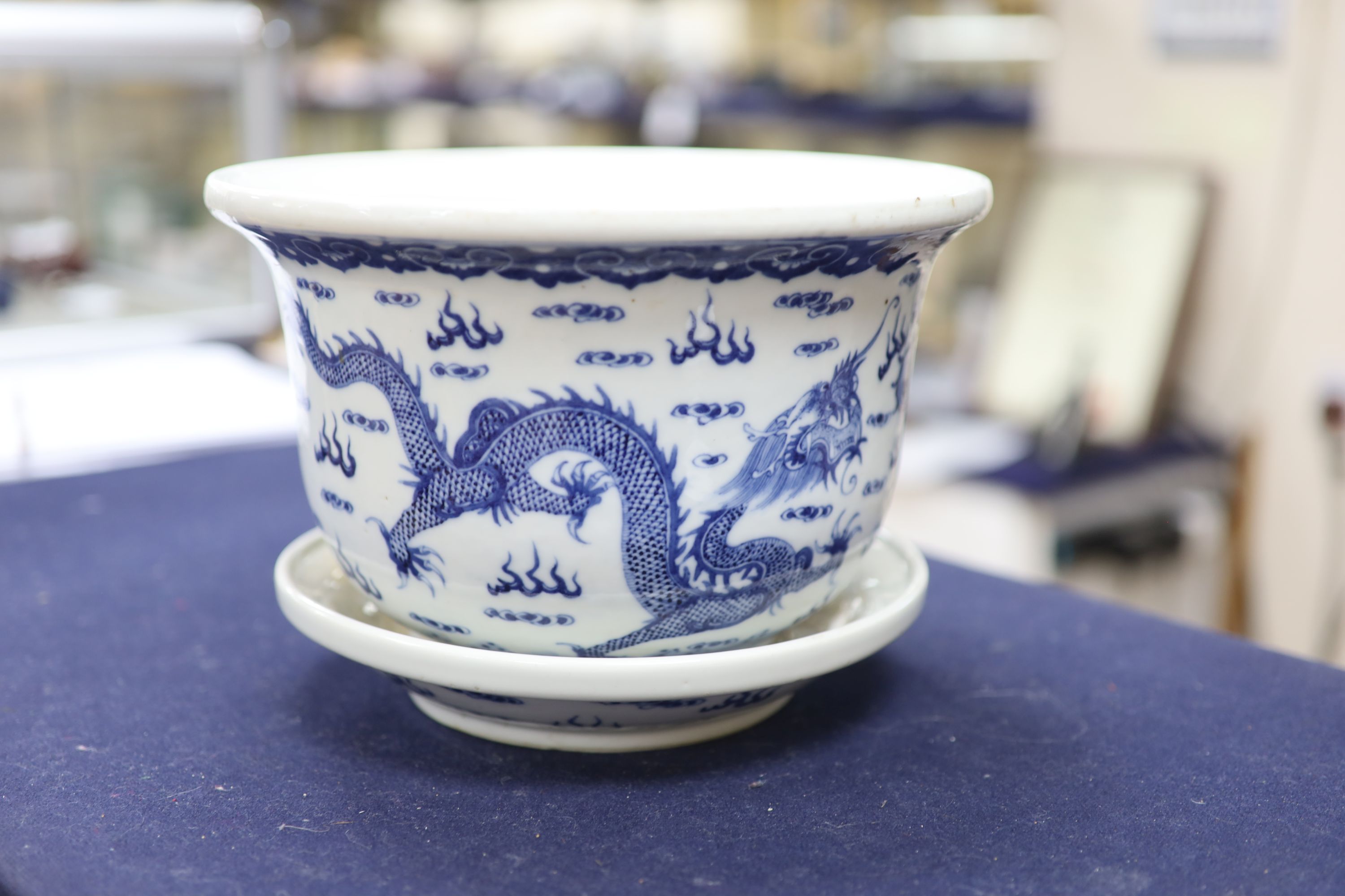 A 19th century Chinese porcelain jardiniere on stand